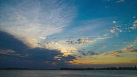 4k Timelapse / Sky Time-lapse Of Sunset Over The Lake / Beautiful Clouds Motion Video stock 231905290