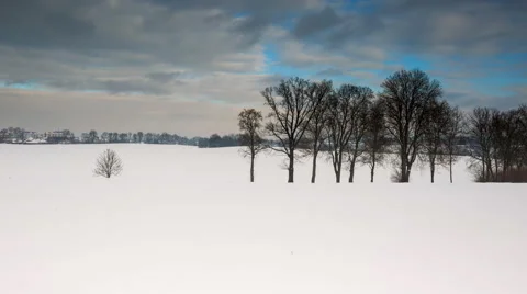 4k timelapse of snow field under cloudy sky Stock Footage 60225394