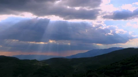 4k timelapse of sun rays sweeping across rolling hills in Italy Stock Footage 213980580