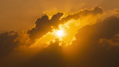 4K Timelapse of sun rising through clouds Video stock 148557695