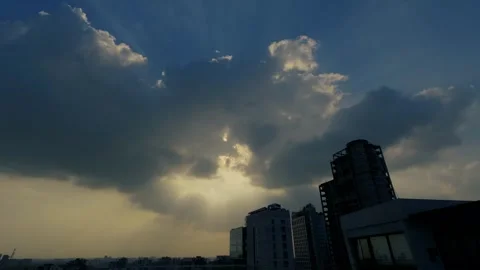 4K Timelapse of Sunlight Breaking Through Clouds from Rooftop in Dhaka Stock Footage 315638093