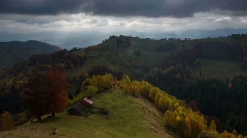 4k timelapse of sunrays beaming through clouds in Transylvania, Romania. Stock Footage 77677081