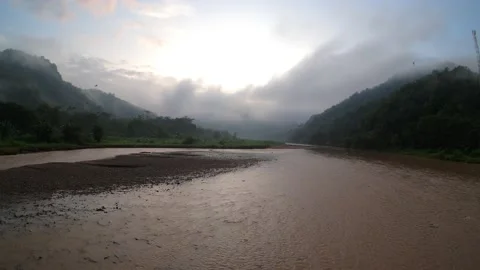 4K timelapse sunrise by the river with thick clouds Stock Footage 186352755