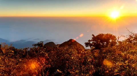 4K Timelapse, Sunrise through flowing cloud waves on hill. Stock Footage 36092734