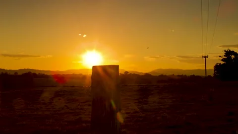 4K Timelapse of Sunset Behind Farm Fence Stock Footage 139186731