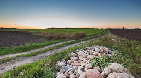 4k timelapse of sunset over fields and rural road Stock Footage 58952237