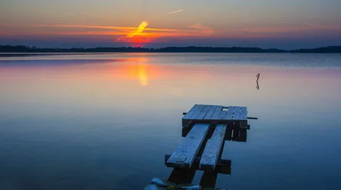 4k timelapse sunset over lake and wooden pier Stock Footage 61714969