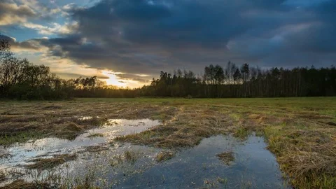 4k timelapse with sunset sky over flooded meadow Stock Footage 82191306
