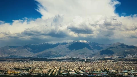 4K Timelapse of Tehran-Iran cityscape with Tochal peak and storm clouds Stock-Footage 276152216