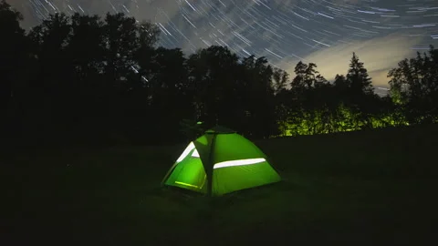 4k timelapse with tent in forest under starry night sky. Video stock 162119467