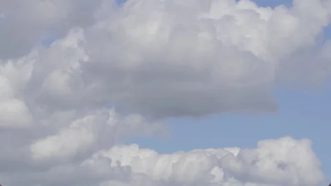 4k timelapse of thick white clouds in front of blue sky (1) Video stock 75158952