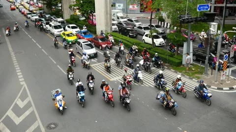 4k timelapse time lapse busy city traffic rush hour center cars motorbikes money Stock Footage 56625059