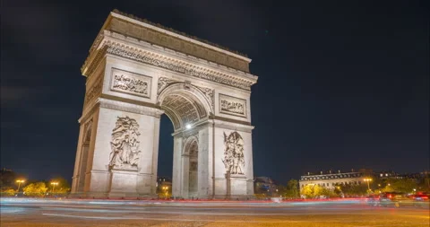 4K Timelapse traffic at Arc de Triomph at night in heart of Paris, France. Video stock 245130197