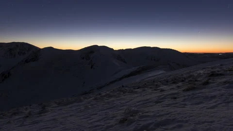 4K Timelapse Transition from Sunset to Starry Night, Snowy Mountains in Low T Stock Footage 146763261