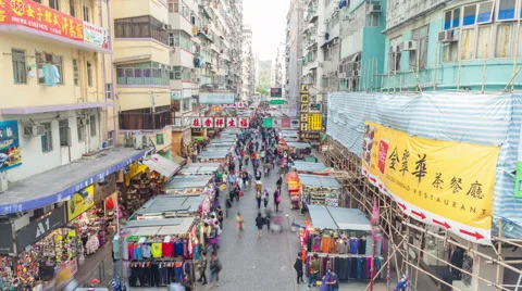 4k timelapse video of street vendors and people shopping in market in Hong Kong Stock Footage