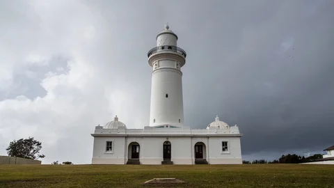 4K Timelapse of a white lighthouse with clouds changing Stock Footage 90638373