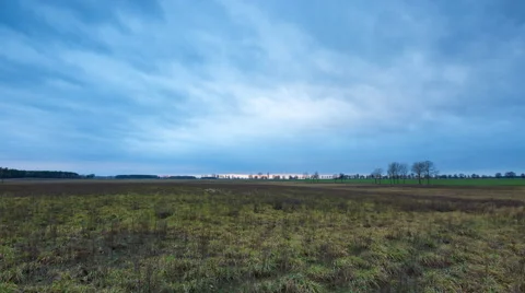 4k timelapse of withered grassland under cloudy sky at sunset Stock Footage 60189714