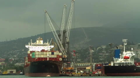 4K Timelapse working cranes loading container ship at sea port Stock Footage 64921623