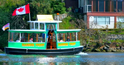 4K Tiny Harbor Ferry, Canadian Flag, Vancouver Victoria British Columbia 動画素材 57677695