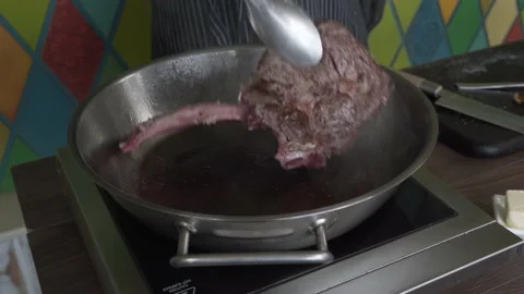4K . Tomahawk steak is a rib eye served on a long, stripped rib. Stock Footage 146805009