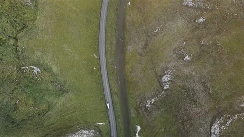 4k Top down aerial car tracking shot on beautiful country road at sunset 2 Stock Footage 105864773