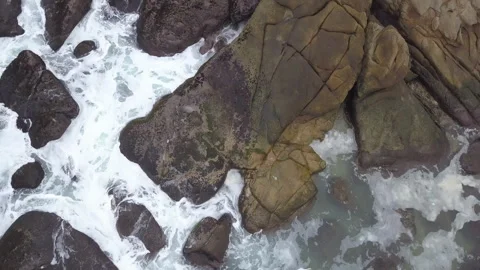 4K Top Down Aerial of Ocean Waves Crashing on Mossy Rocks, Sanya Stock Footage 336527224