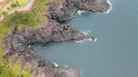 4K Top-down Aerial View of Jusangjeollidae (주상절리대) cliffs, Jeju Volcanic Island Stock Footage 143863591