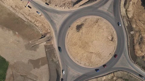 4k Top down aerial view of a traffic roundabout. Road construction Stock Footage 157388999