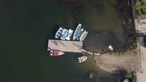4K Top Down drone video of boats at pier Video stock 123857630