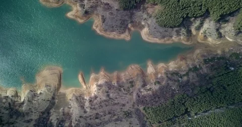 4K Top Down drone video above turquoise color lake Stock Footage 125735334