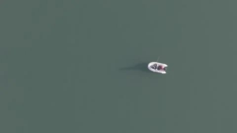 4K Top down drone video of boat with fisherman Stock Footage 300294124