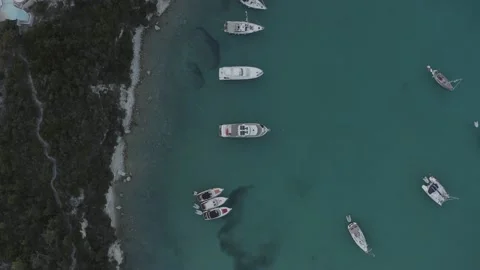 4K top down drone view of anchored sailing boats at Paxos island - Dlog Stock Footage 131611144