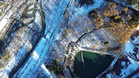 4K Top-Down Rotating View Above Snow-Covered Forest Landscape by Drone Stock Footage 257786456