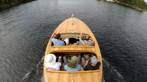 4K TOP DOWN SHOT OF 5 FRIENDS IN A LUXURY SPEEDBOAT ON LAKE SUPERIOR Stock Footage 110773188