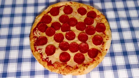 4K top down view of fresh crispy cheesy pepperoni pizza golden crust on a p.. Stock Footage 318251763