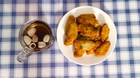 4K top down view of glass cup beverage and crispy hot fried chicken wings w.. Stock Footage 318252018