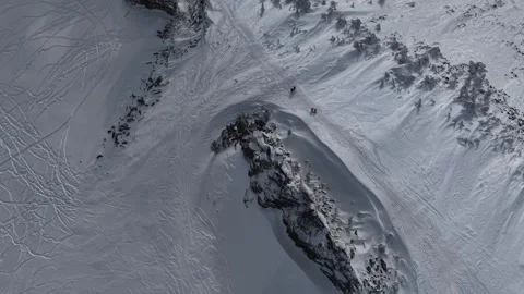 4K Top-Down View of Snowboarders on Sheregesh Mountain Slope Stock Footage 330517745