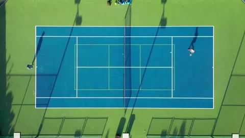 4K top-down view on a tennis court where energetic athletes are playing tennis Stock Footage 132746343