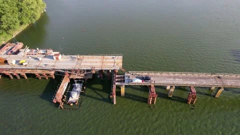 4K Top view construction bridge over the river work. Shooting around the subject Stock Footage 155367857