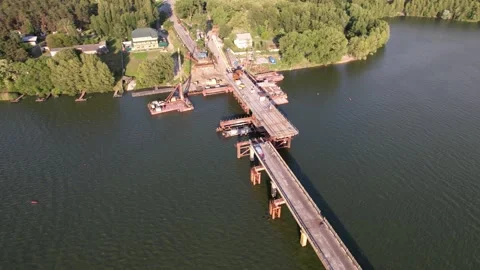 4K Top view construction bridge over the river work. Shooting around the subject Stock Footage 155426116