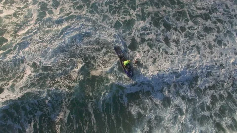 4K top view of jet ski circling around in seashore water in Nazare, Portugal Stock Footage 159841855
