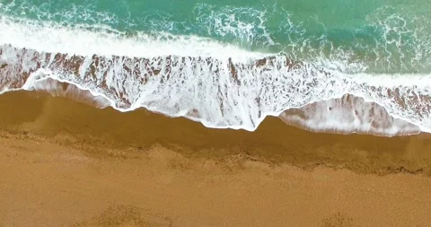 4k Top View of Waves on Sandy Beach with Beautiful Patterns Stock Footage 149867316