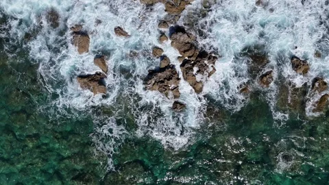 4K Top‑Down Drone Footage of Waves Breaking Over Rocky Seabed in Cyprus Stock Footage 307283738
