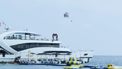 4K Tourist Parasailing Over a Pristine Phu Quoc Beach, Vietnam Travel Stock Footage 319346842