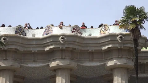 4K Tourist people enjoy Gaudi terrace in Barcelona Park Guell touristic landmark Stock Footage