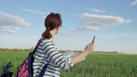 4K. A tourist studies a map of the area in the field Stock Footage 201088767