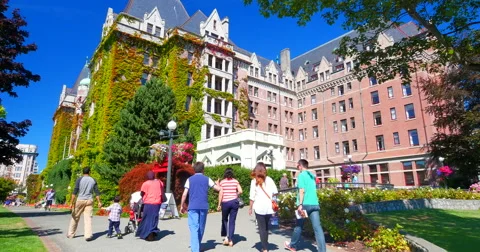 4K Tourists Passing in Front of Empress Hotel, Tilt Shot Stock Footage 41395567