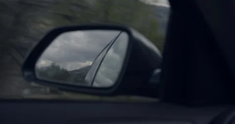 4K Tourists Rear View Mirror in a car in The Glen Coe Scottish Mountains. Stock Footage 93070452