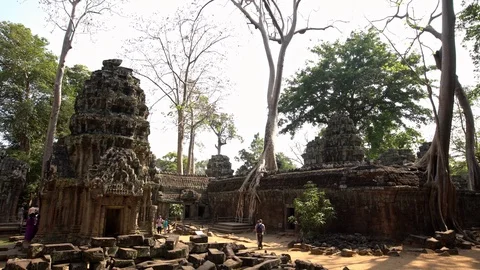 4K, Tourists visit the Ta Phrom temple in Angkor Thom. Archaeological temple-Dan Stock Footage 119059888