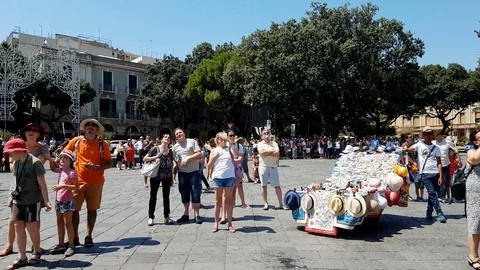4k Tourists wait the famous show of clock tower of Messina Cathedral Messina Stock Footage 115123796